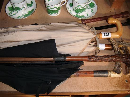 Collection of brollies & riding crops etc